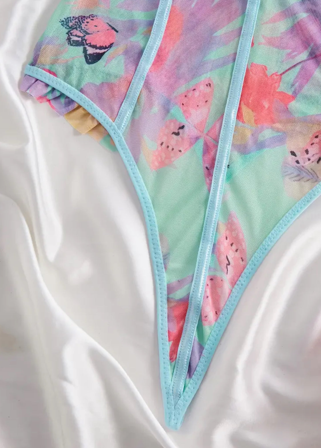 Body sexy con estampado floral y detalle de volantes: tejido elástico semitransparente