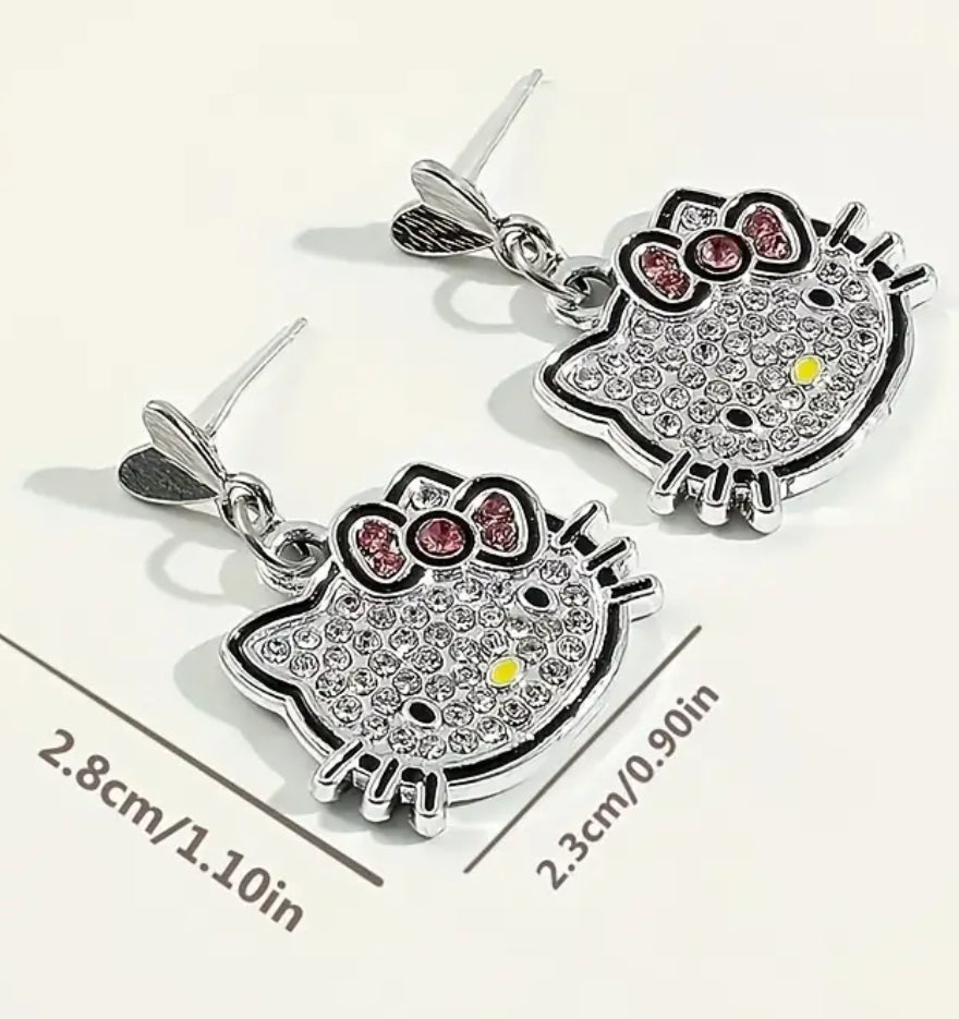 Conjunto de joyas de Hello Kitty con licencia de Sanrio: encantador collar y pendientes con colgante