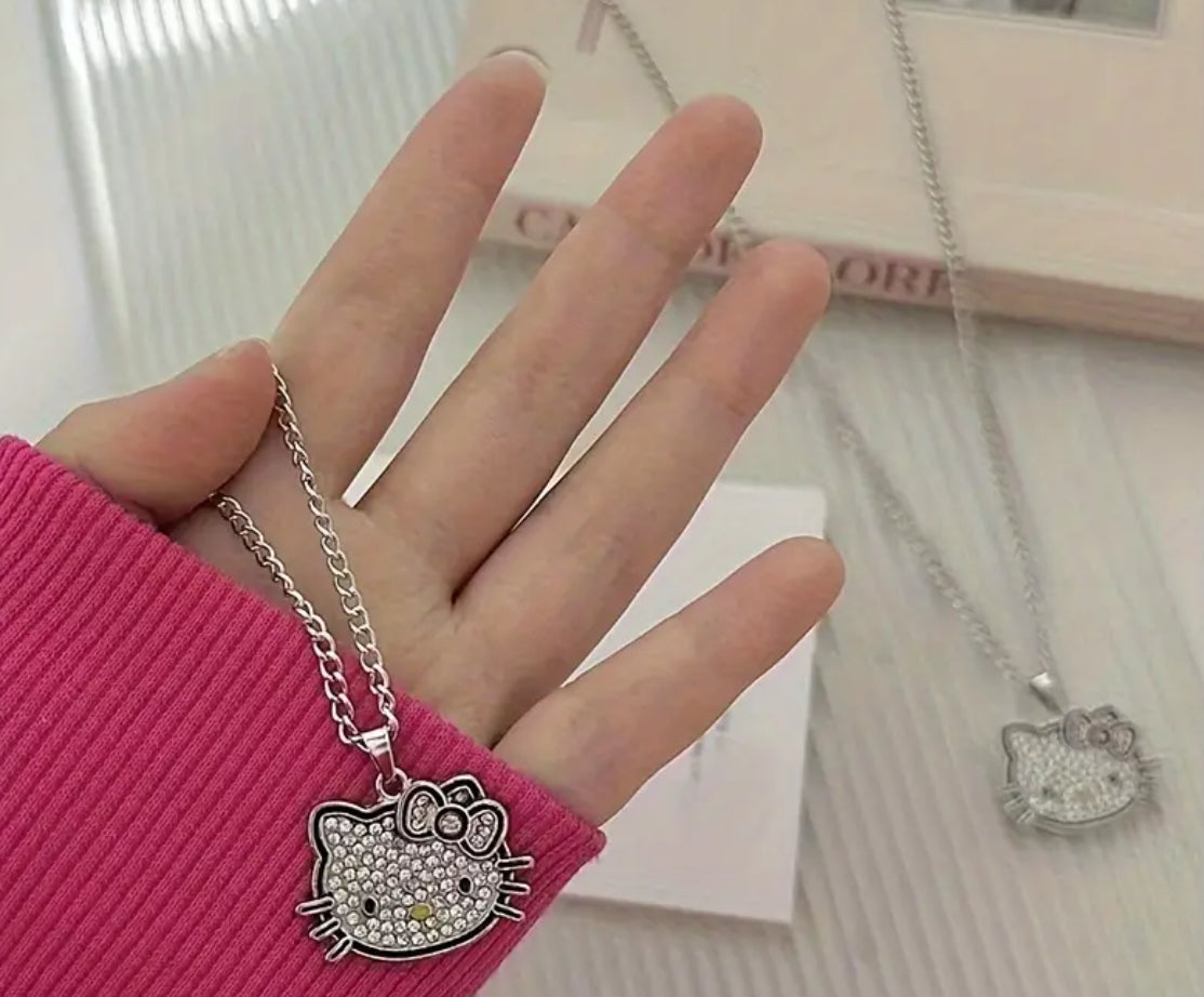 Conjunto de joyas de Hello Kitty con licencia de Sanrio: encantador collar y pendientes con colgante