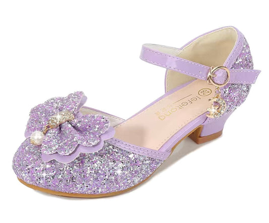 The Brights, tacones altos princesa con lazo de perlas y purpurina